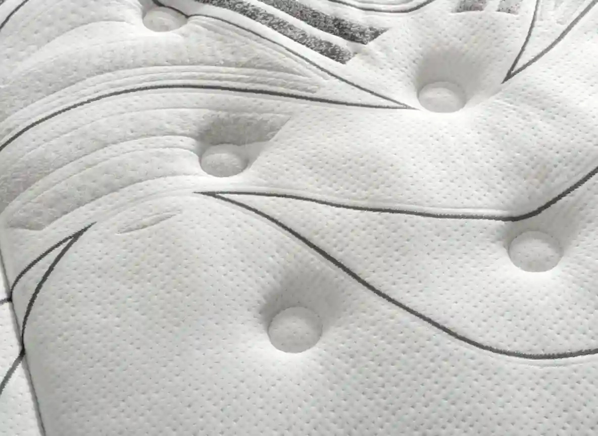 Detalle del colchón boom, suvidad, durabilidad y sueño reparador